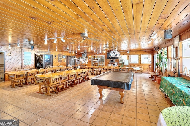 game room with light tile patterned floors, billiards, wood ceiling, and wood walls