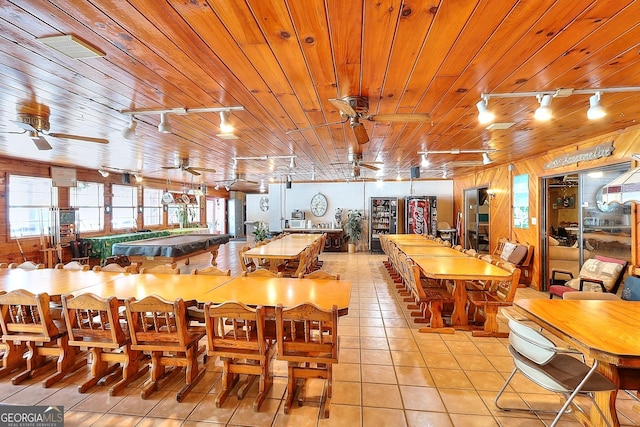 tiled dining space featuring wooden walls, wooden ceiling, pool table, and track lighting