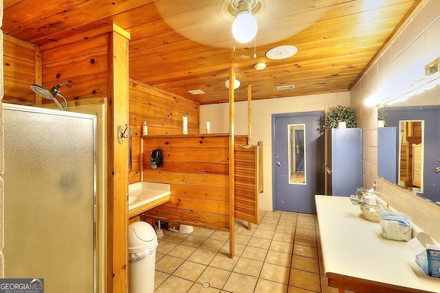 bathroom with tile patterned flooring, wooden ceiling, and an enclosed shower