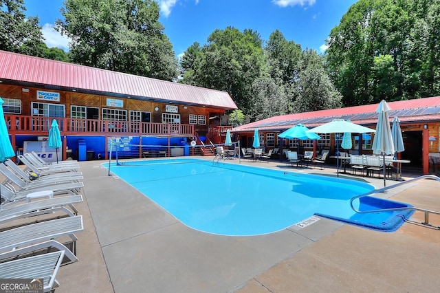 view of pool featuring a patio area