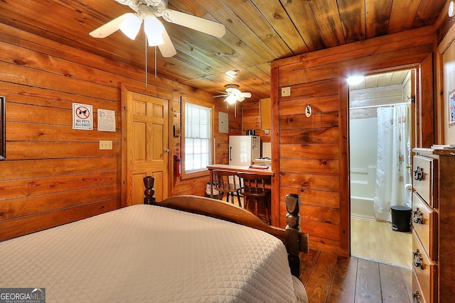 bedroom with wood walls, dark hardwood / wood-style flooring, ceiling fan, and wood ceiling