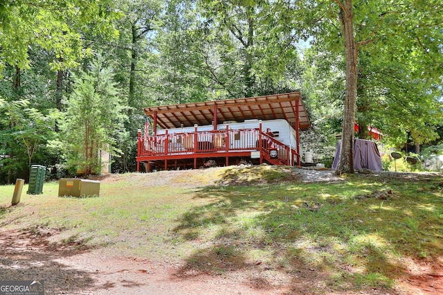 rear view of house with a deck