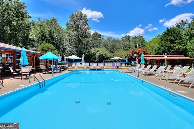 view of swimming pool with a patio