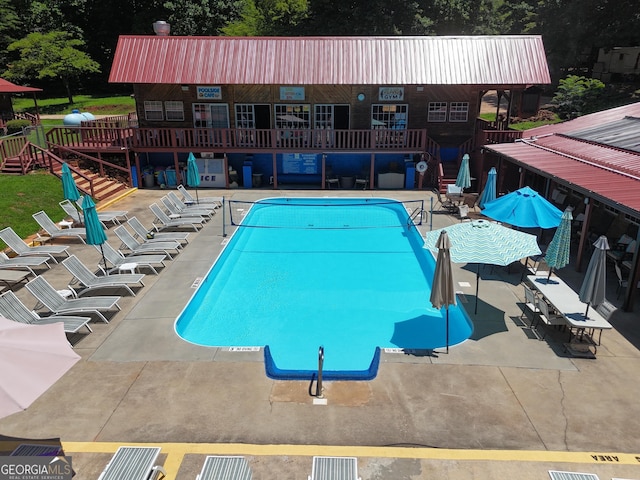 view of swimming pool featuring a patio area