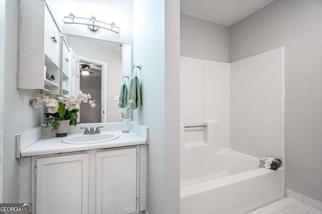 bathroom with tile patterned floors, vanity, and shower / bath combination