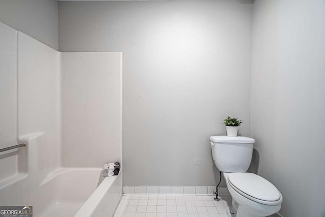 bathroom featuring tile patterned flooring, shower / bathtub combination, and toilet