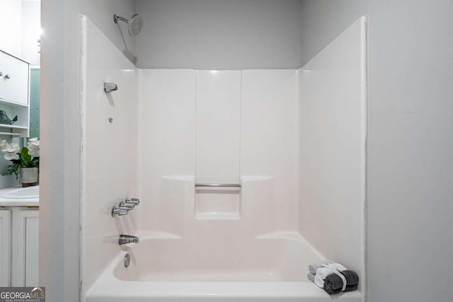 bathroom featuring shower / bathing tub combination and vanity