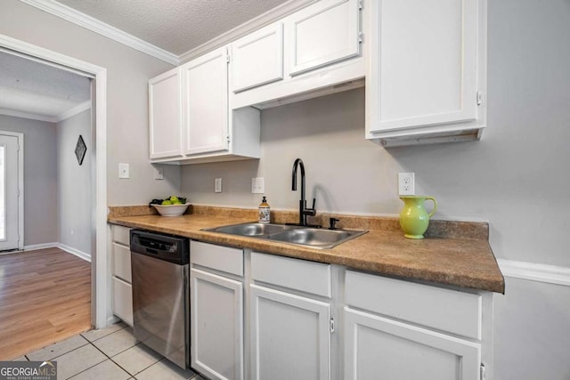 kitchen featuring white cabinetry, dishwasher, light hardwood / wood-style floors, and sink