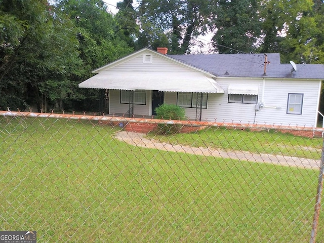 ranch-style home with a front yard