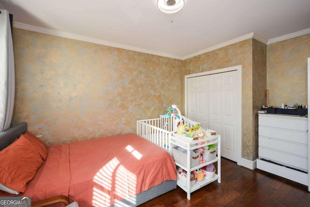 bedroom featuring a closet, crown molding, and dark hardwood / wood-style flooring