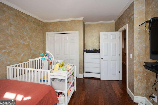 bedroom featuring a closet, dark hardwood / wood-style flooring, and ornamental molding