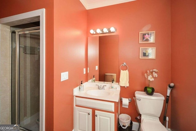 bathroom with vanity, toilet, crown molding, and walk in shower