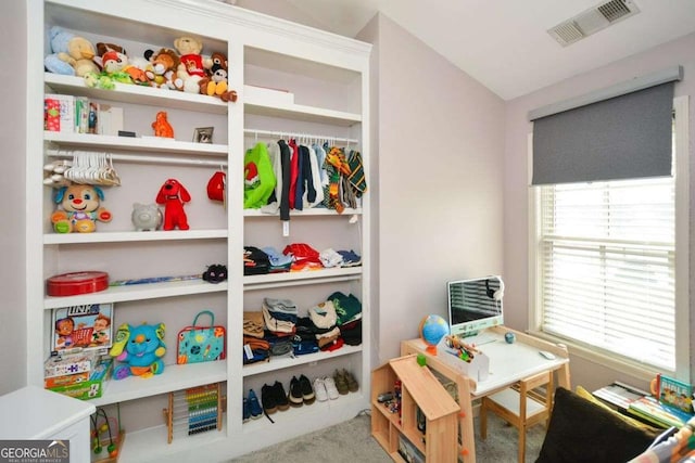 rec room with carpet flooring and vaulted ceiling