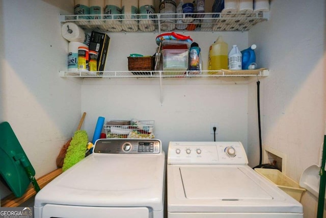 washroom with washing machine and clothes dryer