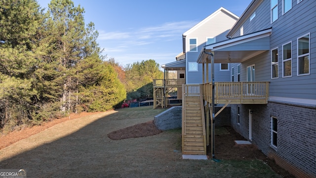 view of yard featuring a wooden deck