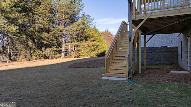 view of yard featuring a wooden deck