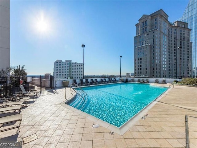 view of swimming pool featuring a patio