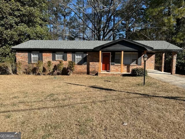 single story home with a carport and a front lawn