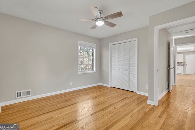 unfurnished room with ceiling fan and light hardwood / wood-style flooring