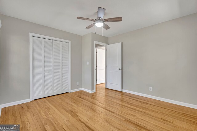 unfurnished room featuring light hardwood / wood-style floors and ceiling fan