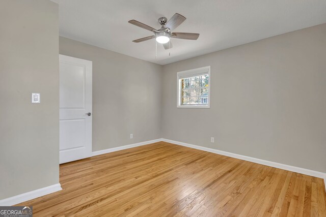 unfurnished room with ceiling fan and light hardwood / wood-style floors