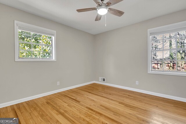 unfurnished room featuring ceiling fan and light hardwood / wood-style flooring