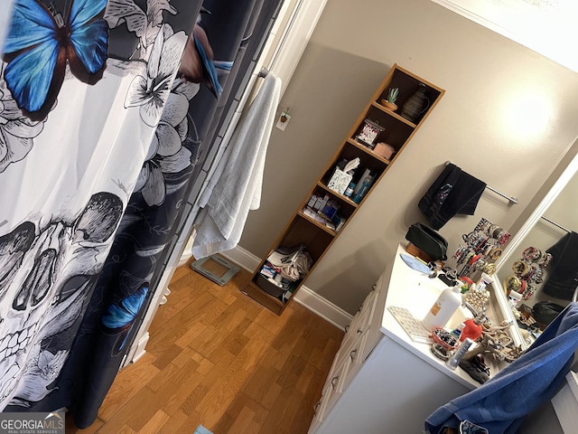 spacious closet featuring wood finished floors