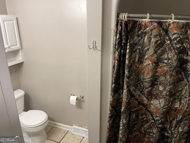 bathroom featuring toilet