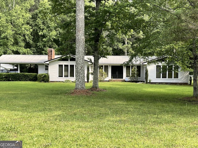 1088 New Rosedale Rd NE, Armuchee, GA 30105 - view of front of house featuring a front lawn, a chimney, and metal roof