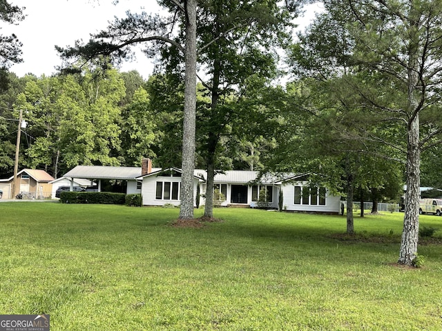 1088 New Rosedale Rd NE, Armuchee, GA 30105 - view of front facade featuring a front lawn, metal roof, and a chimney