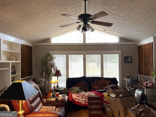 living room featuring ceiling fan, parquet flooring, a textured ceiling, and vaulted ceiling