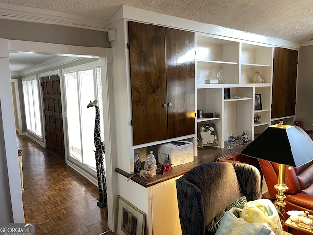 living room with crown molding, a healthy amount of sunlight, dark parquet flooring, and a textured ceiling