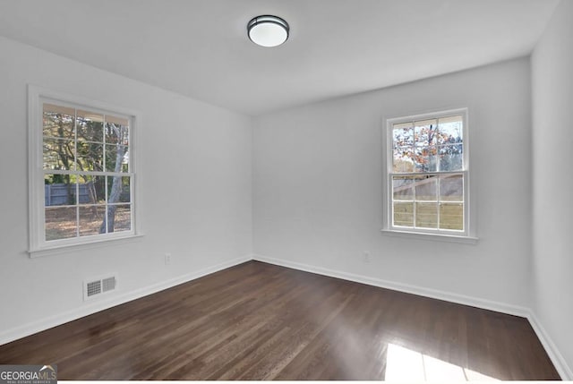 empty room featuring dark hardwood / wood-style floors