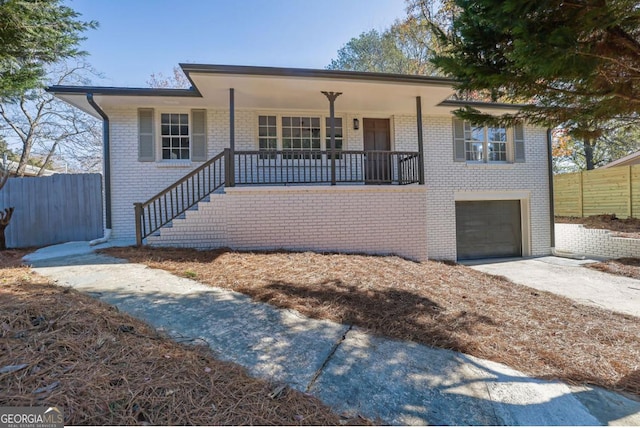 view of front of property with a garage and covered porch