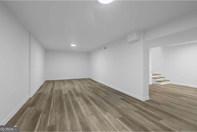 basement featuring dark hardwood / wood-style floors