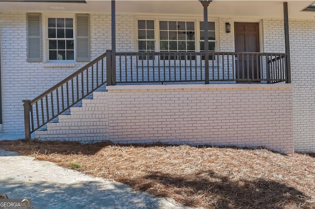 doorway to property with a porch