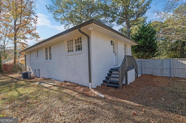 view of home's exterior with central AC unit