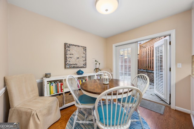 dining area featuring wood-type flooring