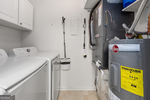 laundry room featuring washer and clothes dryer, cabinets, electric panel, and water heater