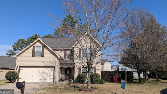 view of front of house featuring a garage and a front lawn