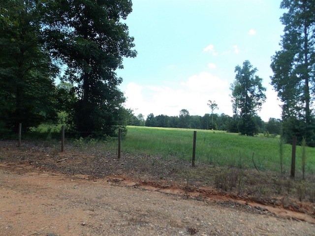 view of yard with a rural view