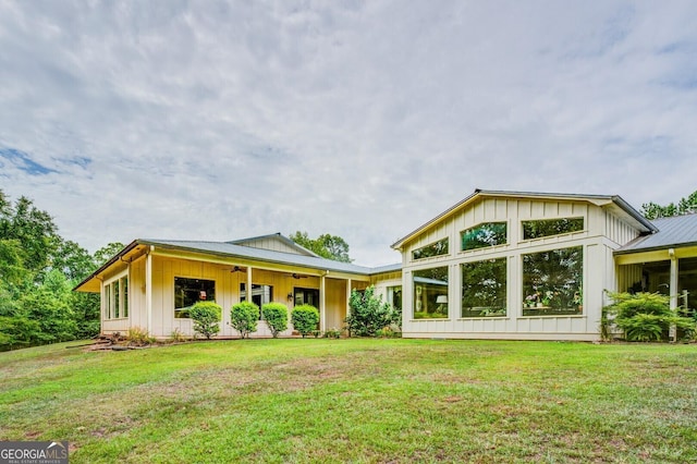 back of house featuring a yard