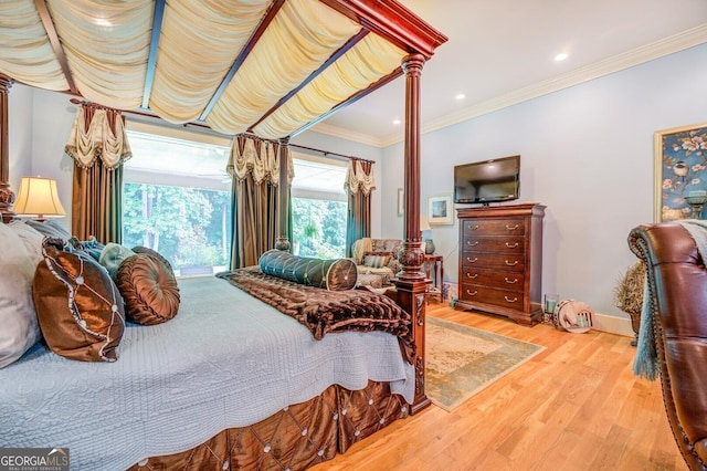 bedroom featuring light hardwood / wood-style floors and ornamental molding