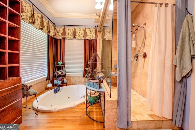 bathroom with hardwood / wood-style floors, crown molding, and shower with separate bathtub