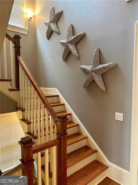 stairway with wood-type flooring