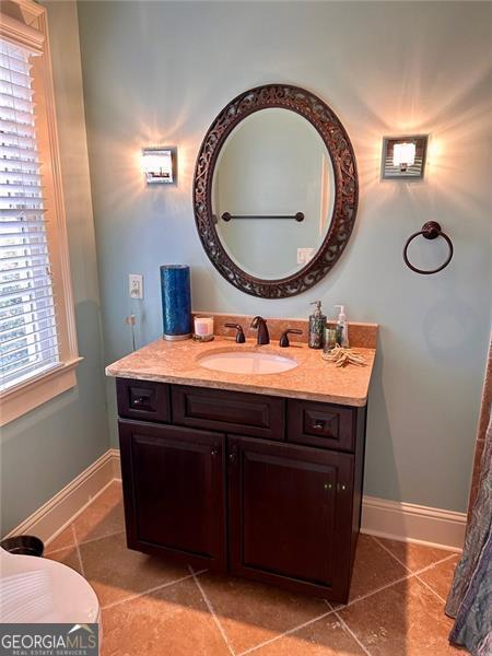 bathroom with vanity, tile patterned floors, and plenty of natural light