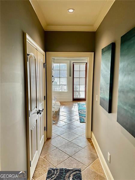 corridor featuring ornamental molding