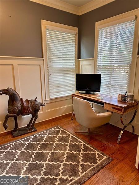 office featuring hardwood / wood-style floors and ornamental molding