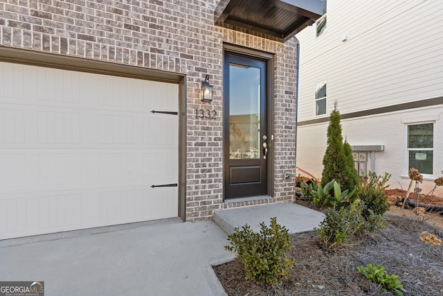 doorway to property featuring a garage