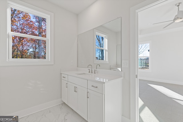 bathroom with vanity, a wealth of natural light, and ceiling fan